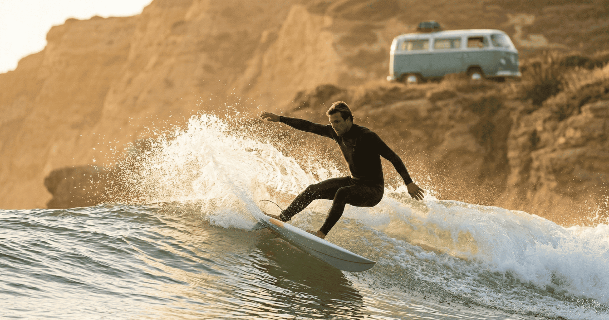 intermediate surfer catching a wave