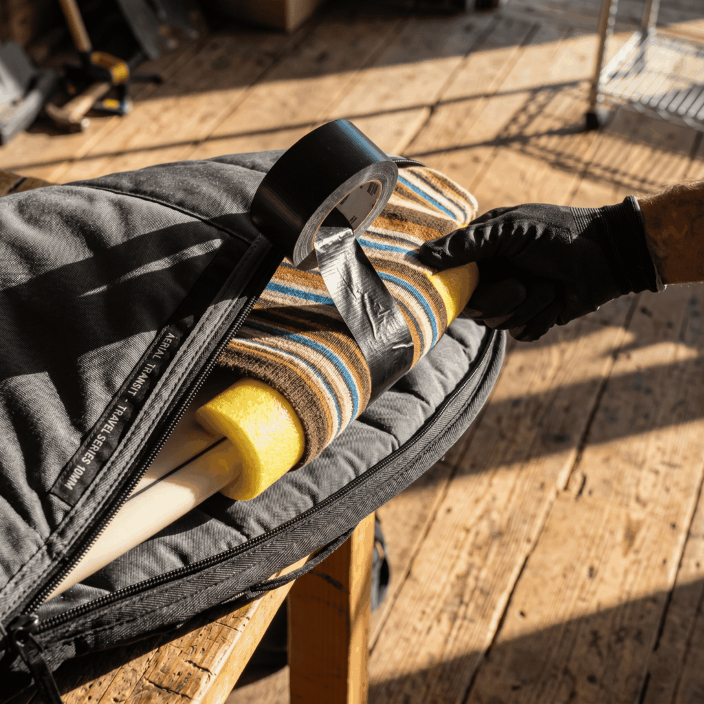 How to protect surfboards for travel: a guide on covers with 10mm padding and foam rail protection.