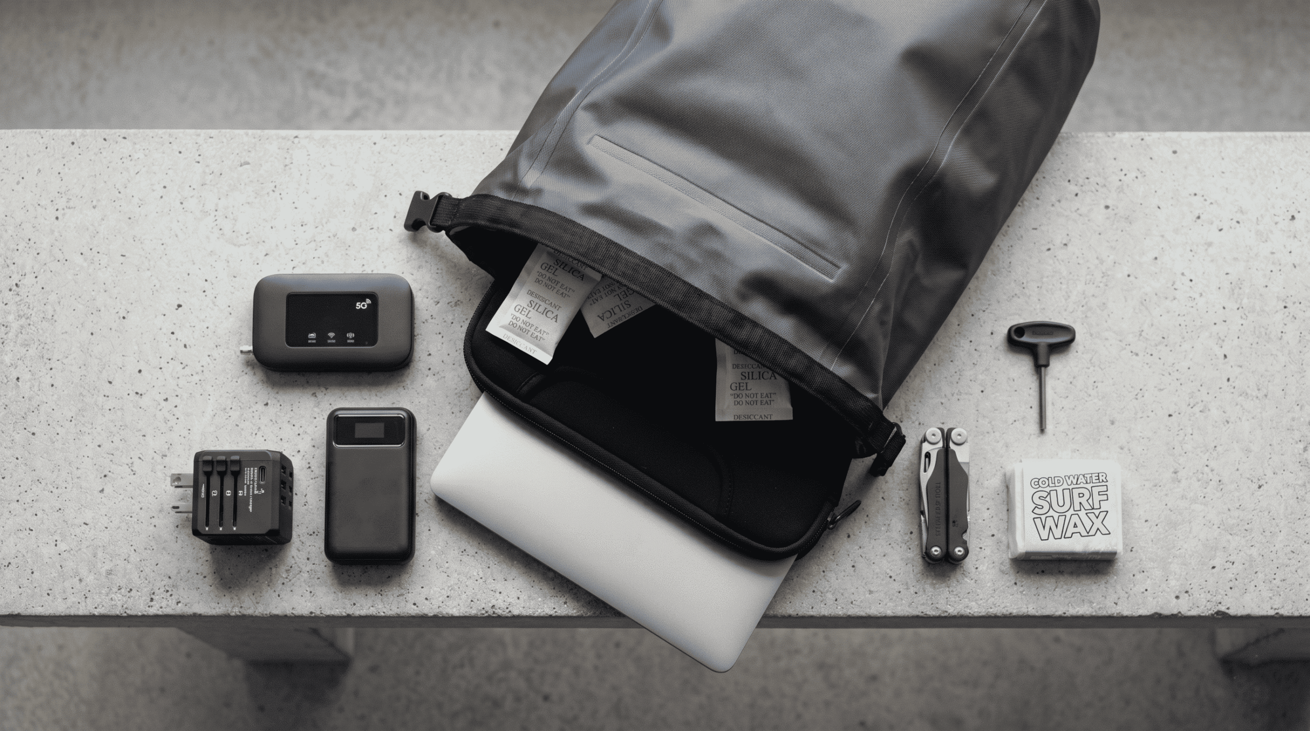 Accessories for digital surf lifestyle nomads: IP68 waterproof backpacks, 5G routers and quiver maintenance tools.